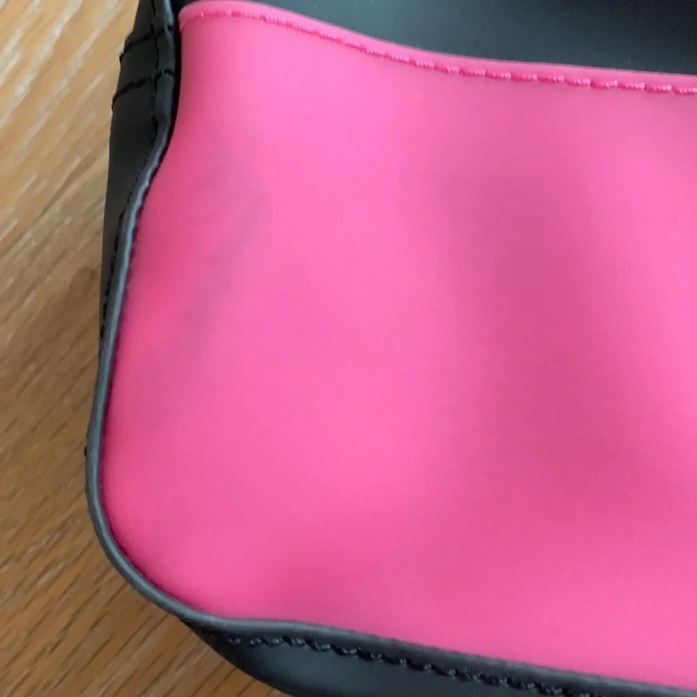 BCBGeneration plastic zippered cosmetic case pink black